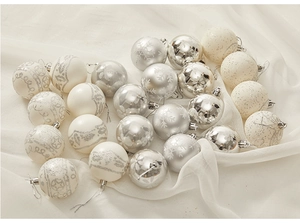 Detail of 8cm silver and cream Christmas balls with glitter and snowflake patterns