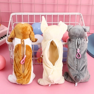 Three plush dog-shaped pencil cases in brown, cream and gray with back zipper closures