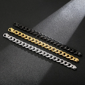 Flat Cuban chain bracelet set in gold, silver, and black finish on textured background