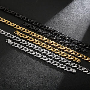 Detail of Cuban chain link clasp with vintage floral engraving in gold, silver and black