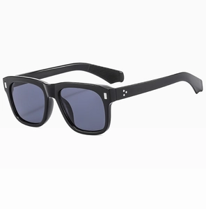 Detail view of glossy black square frame sunglasses with silver triple dot rivets