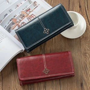 Vintage long women's wallets in green and burgundy faux leather with metal buckles