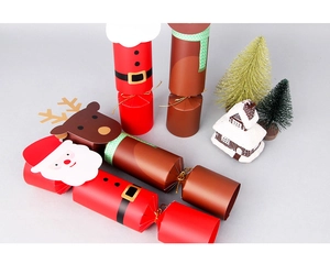 Detail view of Santa and Reindeer Christmas cracker gift boxes with golden ribbons