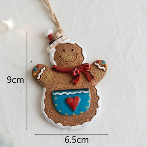 Gingerbread woman resin Christmas tree hanging ornament with dimensions 9cm by 6.5cm