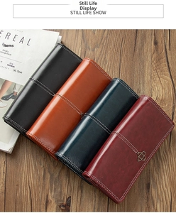 Detail of vintage long leather wallets in multiple colors with elegant white stitching