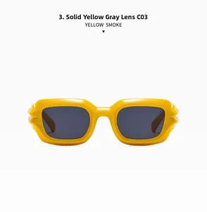 Detail view of bold yellow square frames with punk-style serrated side decoration