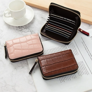 Mini crocodile pattern leather card holder with multiple slots and gold zipper closure