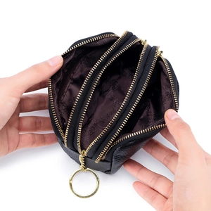 Black genuine leather coin purse with triple zipper design and brown printed lining interior