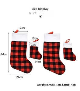 Size chart for buffalo plaid Christmas stockings showing dimensions in cm and weights in grams