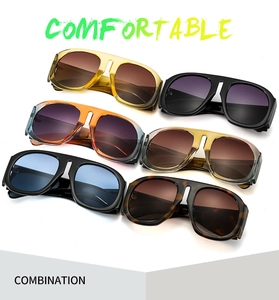 Array of oversized sunglasses in multiple color combinations and wide temples