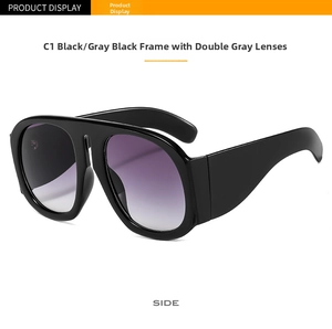 Side view of oversized flat top sunglasses with thick black frames and gradient lenses