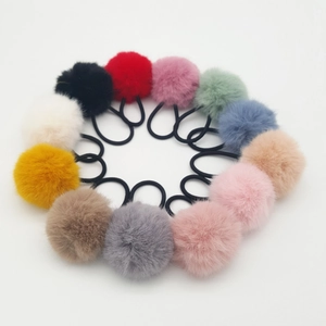 Set of colorful plush pom-pom hair ties in 12 vibrant colors on elastic bands