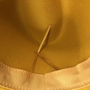 Close-up of the adjustable inner strap and sweatband inside the wool fedora hat