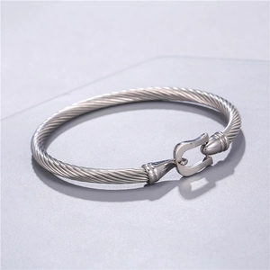 Detail of silver twisted rope cuff bracelet with classic hook clasp in stainless steel