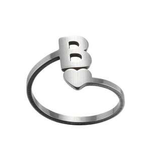 Detail of silver letter B ring with heart shape and brushed metal finish for women