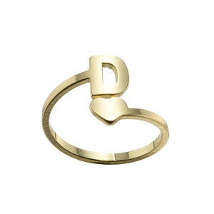 Macro detail of golden open ring featuring a minimalist heart and letter D design