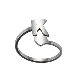 Detailed shot of silver stainless steel open ring with heart and letter K design