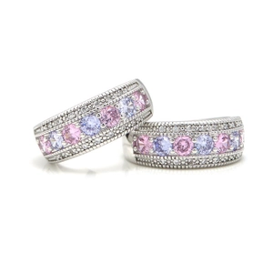 Elegant silver ring set with pink and purple zircon stones in a vintage beaded edge design