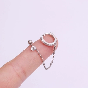 Silver stainless steel chain earring set with sparkling cubic zirconia on pink background