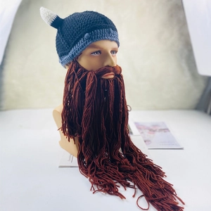 Detail of creative knitted Viking hat with white horns and long brown woolen beard