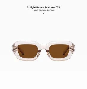 Detailed macro view of rectangular light brown lenses and transparent pink punk frames