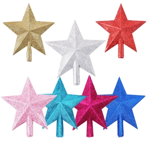 Glittering star Christmas tree toppers in gold, silver, red, and blue on white background