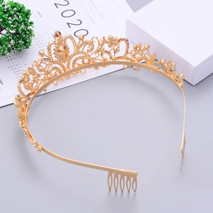 Detailed view of the golden bridal tiara with crystals and integrated hair combs