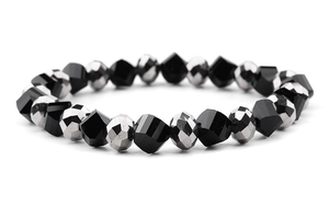 Detail of faceted black and silver glass beads on elastic stretch bracelet strand