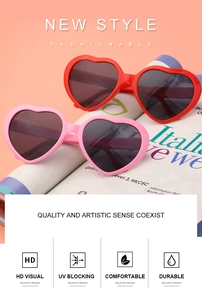 Detail showing red and pink heart-shaped sunglasses with UV protection on aesthetic background
