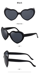 Detailed views of black heart-shaped sunglasses from front, 45-degree and profile angles