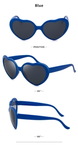 Three-angle views of blue heart-shaped sunglasses with dark grey lenses in detail