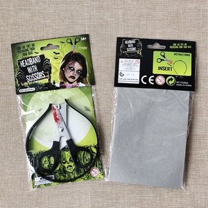 Detail of Halloween zombie scissors headband showing 24x18cm size and packaging