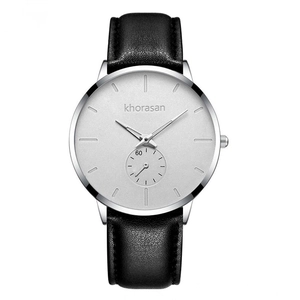 Detail of silver quartz watch with minimal dial, small second sub-dial and black leather strap