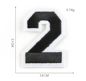 Detail view of black and white embroidered number 2 patch with 5.1 x 3.8 cm dimensions