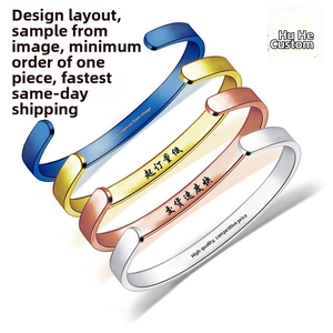 Macro view of customized stainless steel open C-shape bracelets in four metallic colors