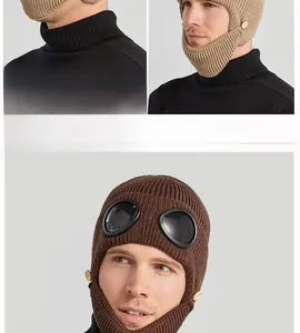 Detail of winter knit aviator hat with signature goggles and full ear protection design