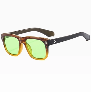 Detail of vintage brown wood-grain frame sunglasses with neon green transparent lenses