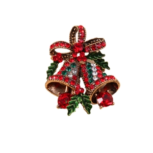 Vintage gold Christmas bell brooch with red and green rhinestones and holly leaf details