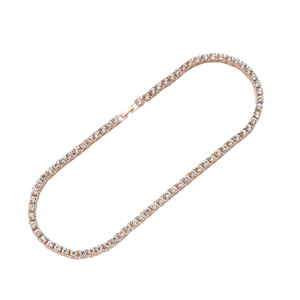 Close-up of rose gold tennis necklace with sparkling crystals on a white background