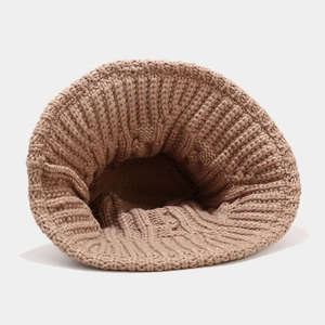 Detailed knit texture of a brown winter bucket hat showing thick wool craftsmanship