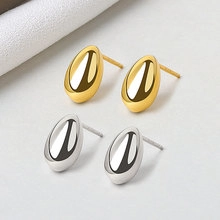 Polished gold and silver teardrop earrings with a mirror-finish minimalist metal design