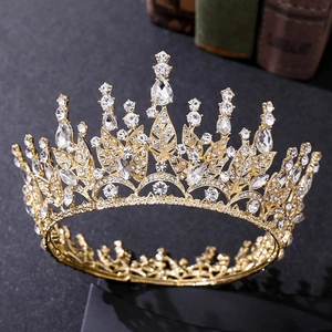 Golden baroque crown with sparkling transparent crystals and leaf motifs for bridal wear