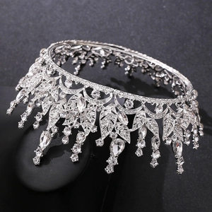 Macro shot of silver bridal crown featuring leaf motifs and water-drop crystal details