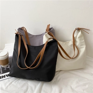 Trio of large canvas tote bags in black grey and beige with adjustable brown straps