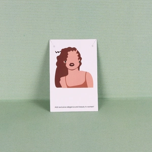 Deep green round stud earrings displayed on a minimalist illustrated white jewelry card