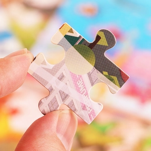 Close-up of high-quality 30-piece wooden puzzle piece with clean cuts and vivid printing
