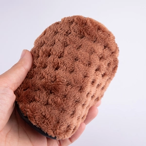 Brown soft plush makeup remover puff with dense ultra-fine fibers and black fabric edge