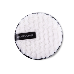 Detailed texture of ultra-soft white microfiber makeup remover puff with ribbon strap