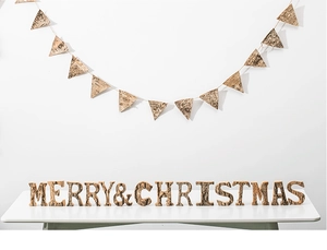 Close-up of natural birch bark Christmas bunting and Merry Christmas wood letters