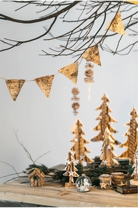 Close-up of natural birch bark Christmas pennants and forest-style festive ornaments